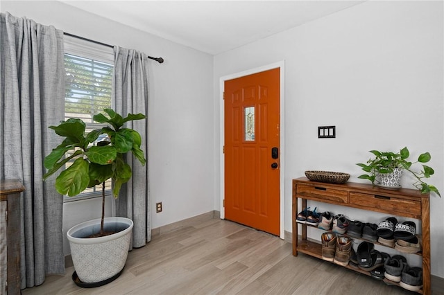 foyer featuring light wood finished floors