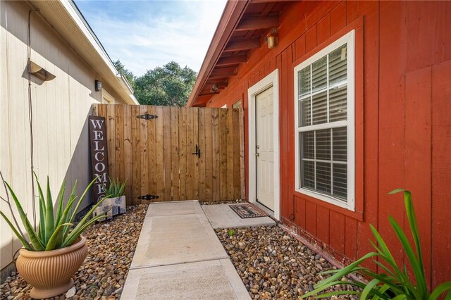 doorway to property with fence