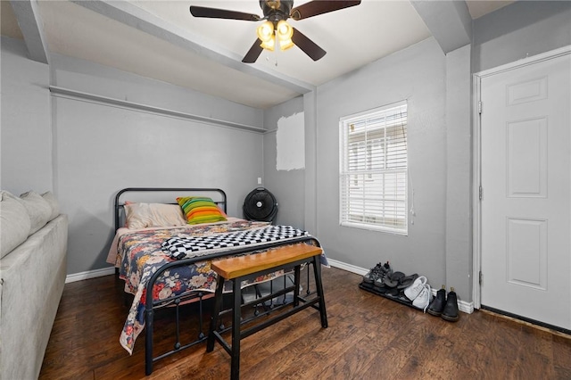 bedroom with baseboards, a ceiling fan, and dark wood finished floors