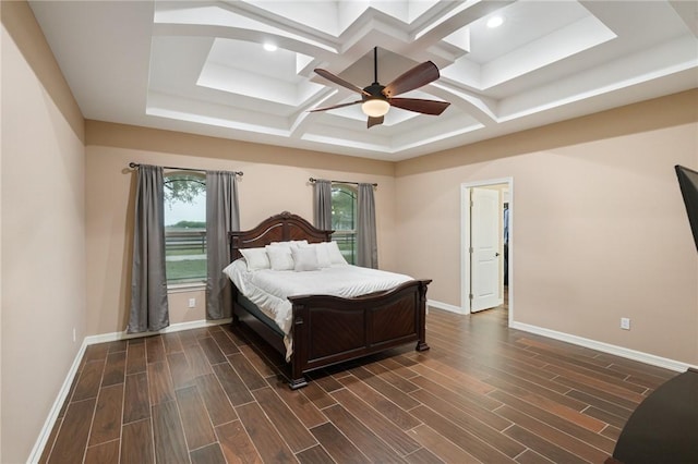 bedroom with coffered ceiling, multiple windows, and baseboards