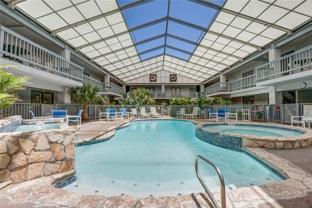 14825 Windward Dr Unit 111, Corpus Christi, TX 78418 - view of pool featuring a pool with connected hot tub, fence, and a patio