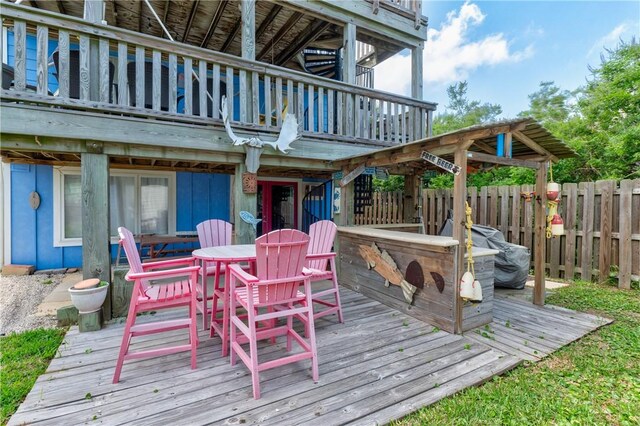 deck featuring fence and outdoor dining area