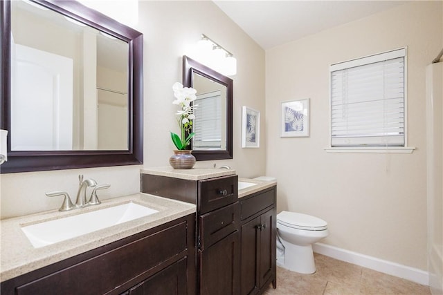 full bath with toilet, tile patterned flooring, baseboards, and vanity