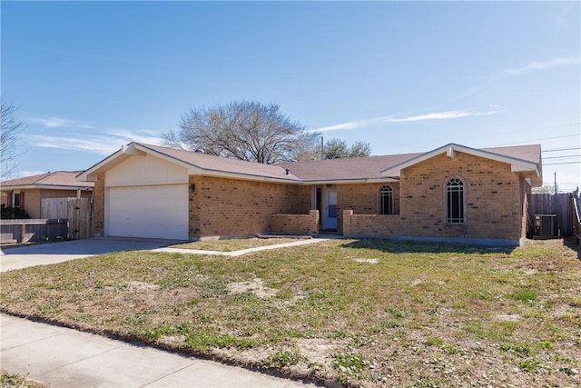 ranch-style house featuring a garage, brick siding, fence, and driveway