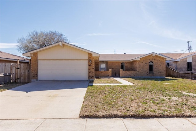 view of front of home featuring a garage, concrete driveway, brick siding, and fence