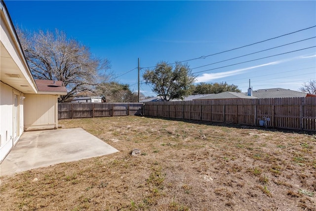 view of yard with a patio and a fenced backyard