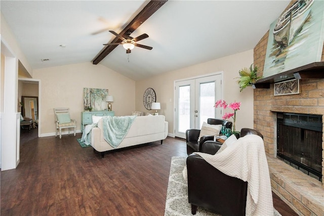 bedroom featuring vaulted ceiling with beams, a fireplace, wood finished floors, access to outside, and french doors