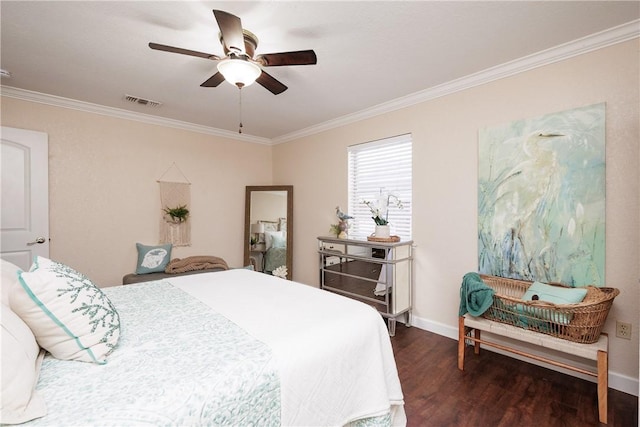 bedroom with ceiling fan, dark wood-type flooring, visible vents, baseboards, and crown molding