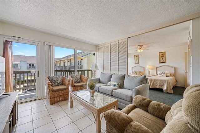 14810 Windward Dr Unit 301, Corpus Christi, TX 78418 - living area with ceiling fan, a textured ceiling, and light tile patterned floors