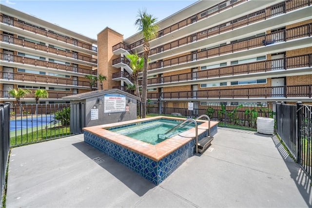 14810 Windward Dr Unit 301, Corpus Christi, TX 78418 - view of pool with a hot tub