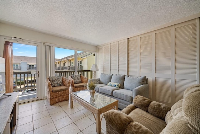 14810 Windward Dr Unit 301, Corpus Christi, TX 78418 - living area featuring light tile patterned floors and a textured ceiling