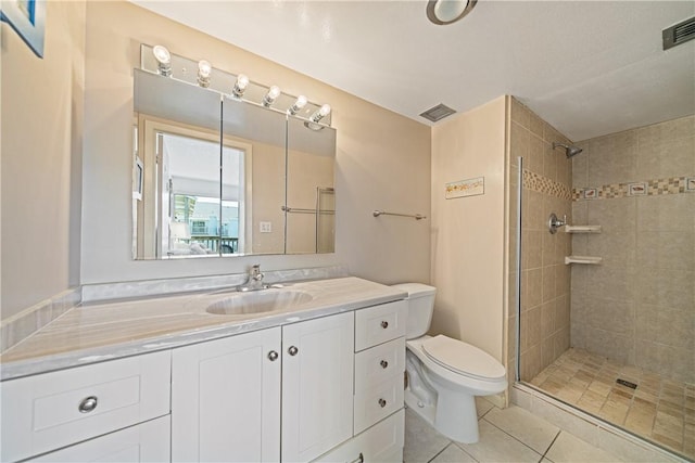 14810 Windward Dr Unit 301, Corpus Christi, TX 78418 - bathroom with tiled shower, vanity, and tile patterned flooring