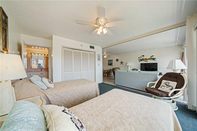 14810 Windward Dr Unit 301, Corpus Christi, TX 78418 - carpeted bedroom with a closet and ceiling fan
