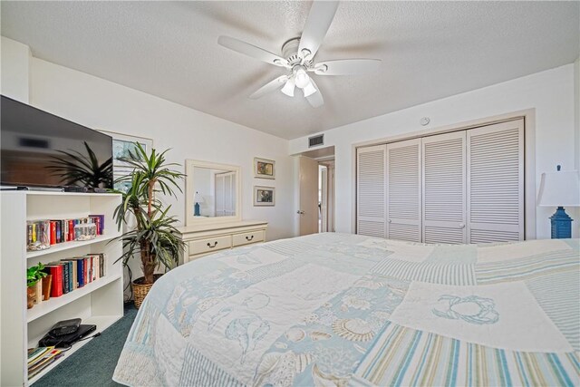 14810 Windward Dr Unit 301, Corpus Christi, TX 78418 - bedroom with carpet floors, a closet, ceiling fan, and a textured ceiling