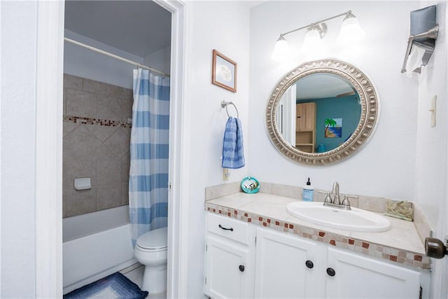 bathroom with shower / bath combo with shower curtain, toilet, and vanity