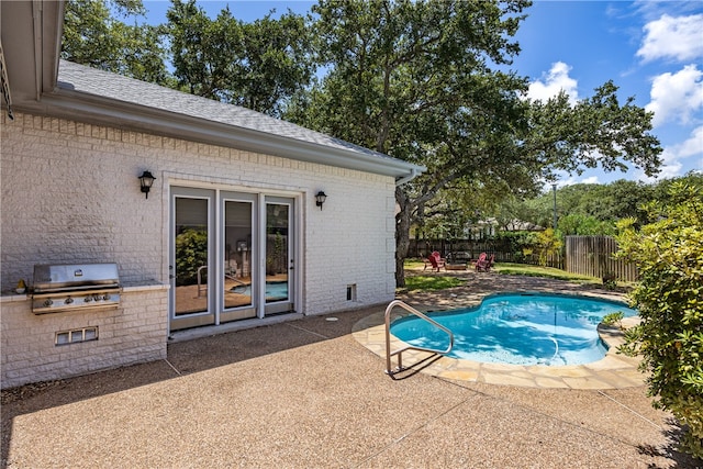 view of swimming pool featuring area for grilling, a patio, and french doors