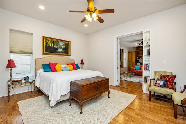 bedroom featuring wood-type flooring and ceiling fan