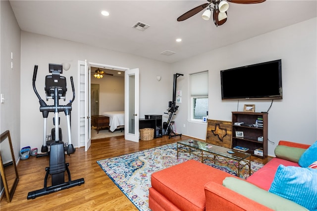 living room with ceiling fan, wood-type flooring, and french doors