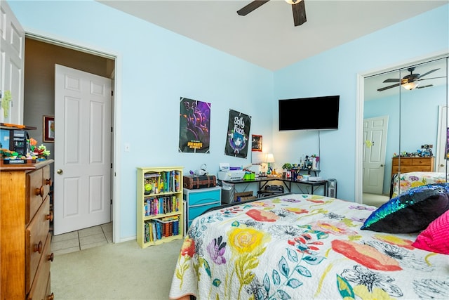 bedroom with ceiling fan and light carpet