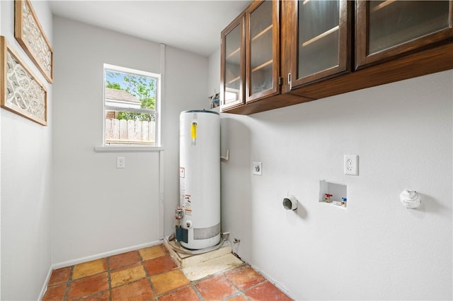6106 Orangewood Dr, Corpus Christi, TX 78412 - laundry area featuring gas water heater, cabinet space, electric dryer hookup, baseboards, and hookup for a washing machine