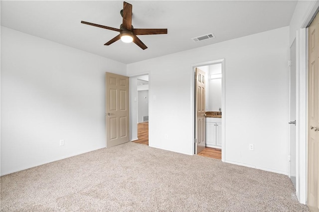 6106 Orangewood Dr, Corpus Christi, TX 78412 - unfurnished bedroom featuring carpet floors, baseboards, ensuite bathroom, and ceiling fan