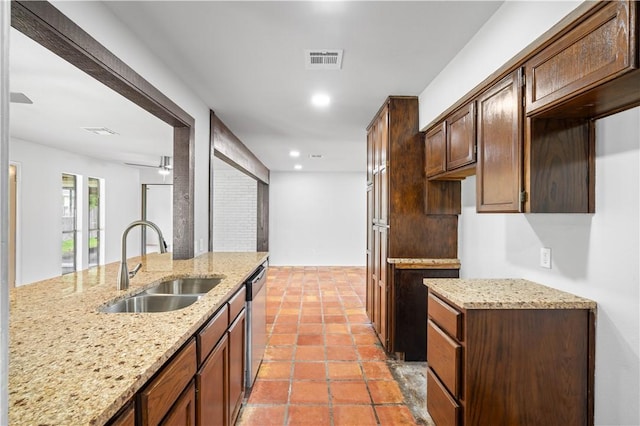 6106 Orangewood Dr, Corpus Christi, TX 78412 - kitchen featuring a sink, dishwasher, light stone counters, recessed lighting, and dark brown cabinetry