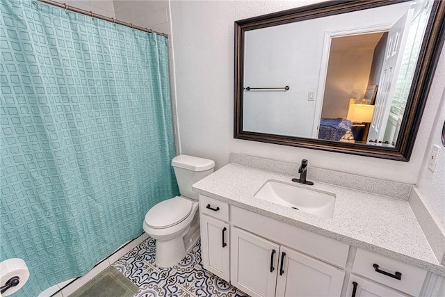 bathroom with toilet, tile patterned floors, a shower with shower curtain, and vanity