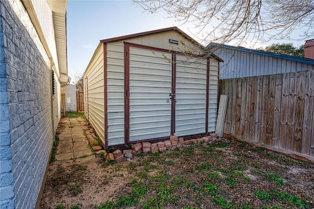 view of shed with a fenced backyard