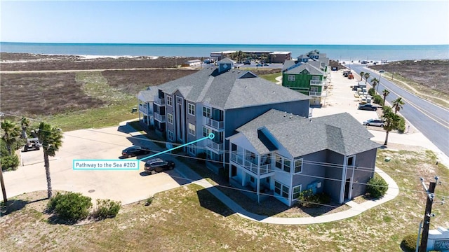 drone / aerial view with a view of the beach and a water view