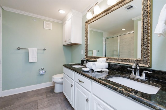 full bath featuring visible vents, a shower stall, crown molding, and a sink