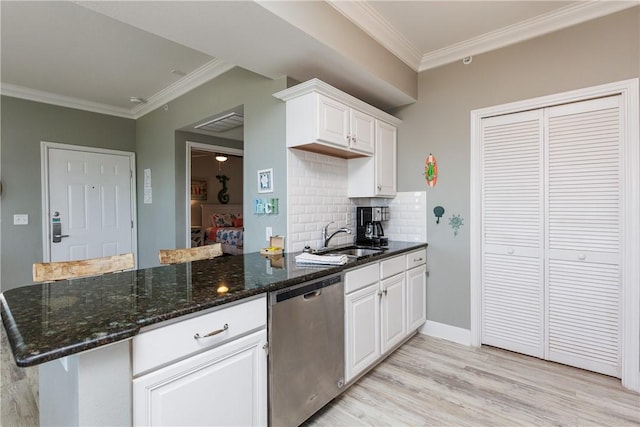 kitchen with white cabinetry, light wood finished floors, a sink, dishwasher, and crown molding