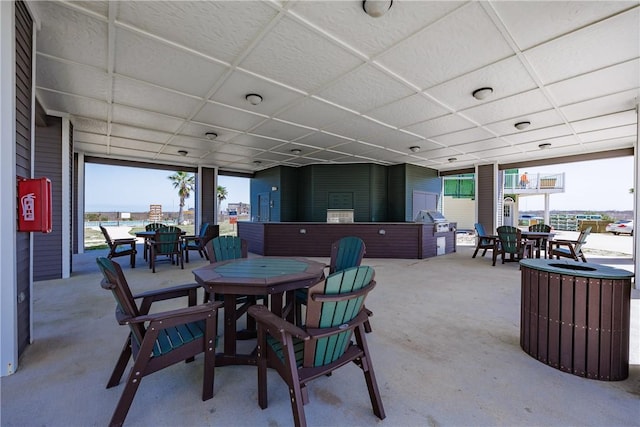 view of patio / terrace featuring outdoor dining area and a grill