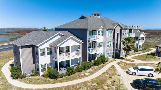 back of house featuring a water view