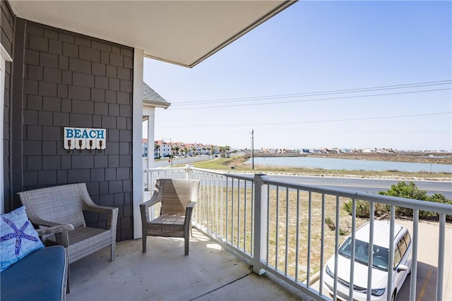 balcony featuring a water view