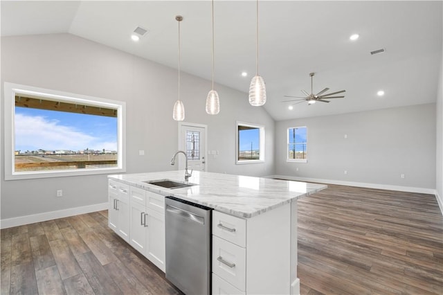 kitchen featuring sink, dishwasher, white cabinetry, hanging light fixtures, and lofted ceiling