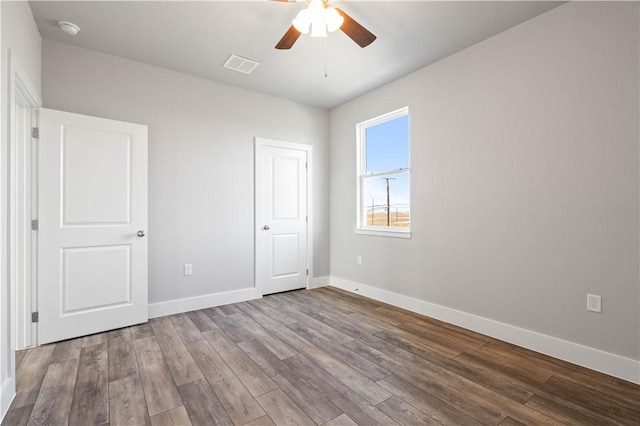 unfurnished bedroom with wood-type flooring and ceiling fan