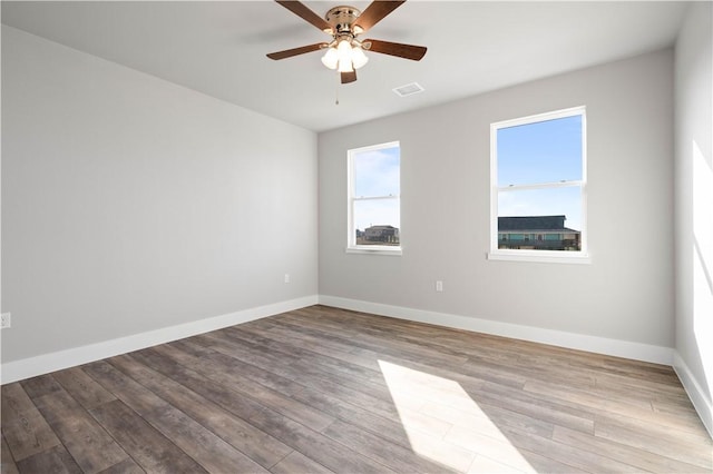 unfurnished room with light wood-type flooring and ceiling fan