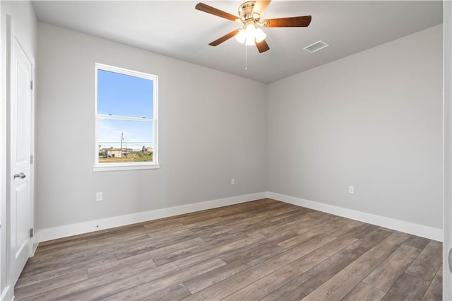 spare room featuring ceiling fan and light wood-type flooring