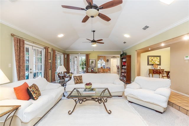 living room with french doors, tile patterned floors, ornamental molding, vaulted ceiling, and ceiling fan