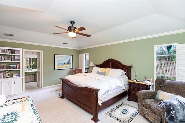 bedroom with ensuite bathroom, light carpet, ceiling fan, and crown molding