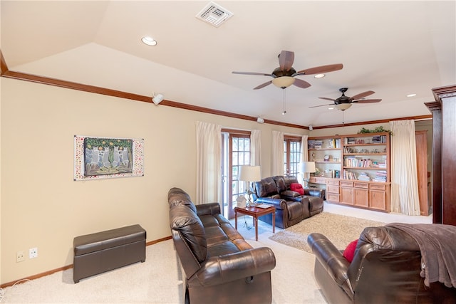 living room featuring lofted ceiling, ceiling fan, crown molding, and carpet