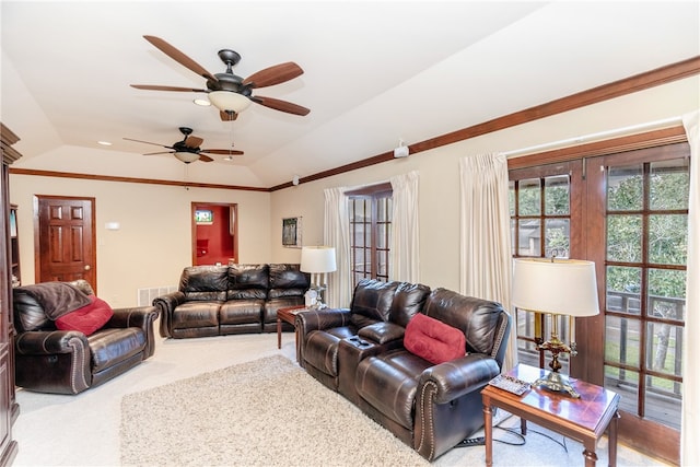 living room featuring ceiling fan, lofted ceiling, and light colored carpet