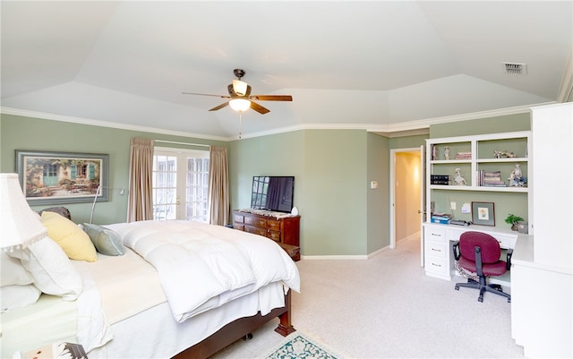 bedroom featuring built in desk, light colored carpet, ceiling fan, and crown molding