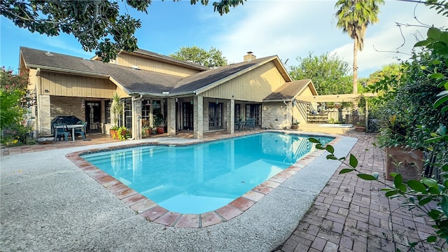 view of pool featuring a patio