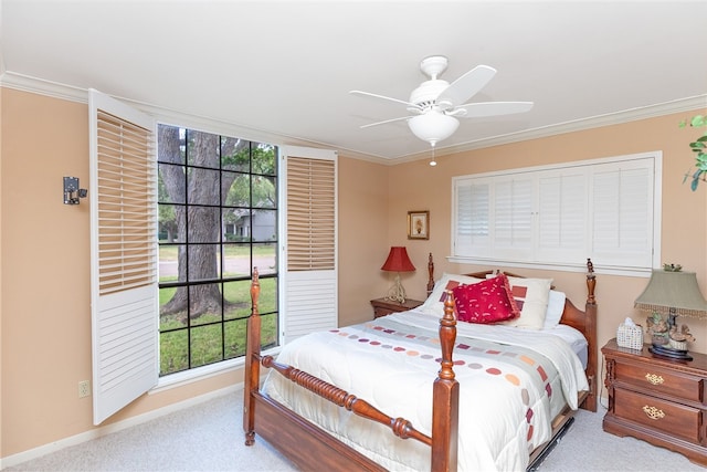 carpeted bedroom featuring crown molding, multiple windows, and ceiling fan