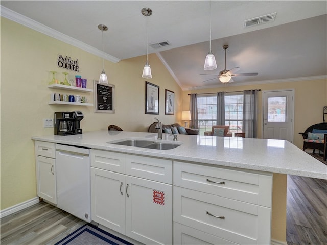 kitchen with white cabinetry, light wood-type flooring, white dishwasher, sink, and vaulted ceiling