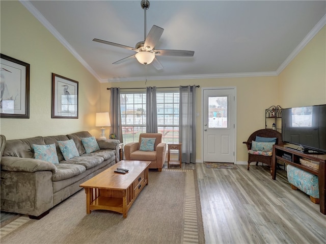 living room featuring light hardwood / wood-style flooring, ceiling fan, and crown molding