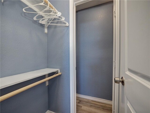 715 Beach Access Road 1a 1204, Port Aransas, TX 78373 - walk in closet with wood finished floors