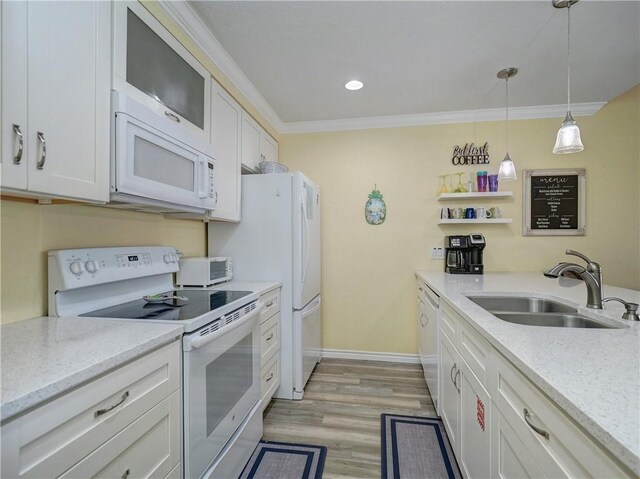 715 Beach Access Road 1a 1204, Port Aransas, TX 78373 - kitchen with white appliances, a sink, crown molding, white cabinetry, and pendant lighting