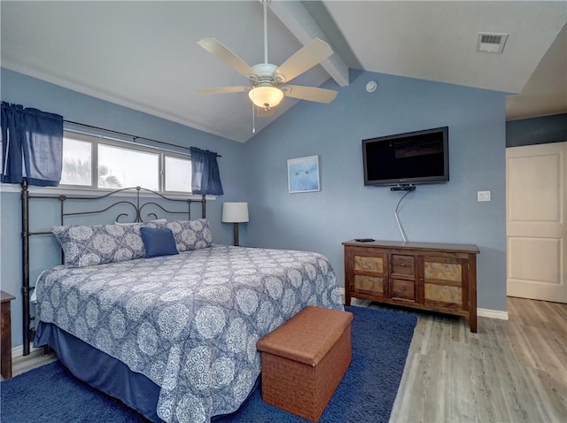 bedroom with light wood-type flooring, vaulted ceiling with beams, and ceiling fan